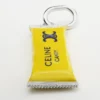 Bedels Candy Bar in email en messing met rhodiumafwerking