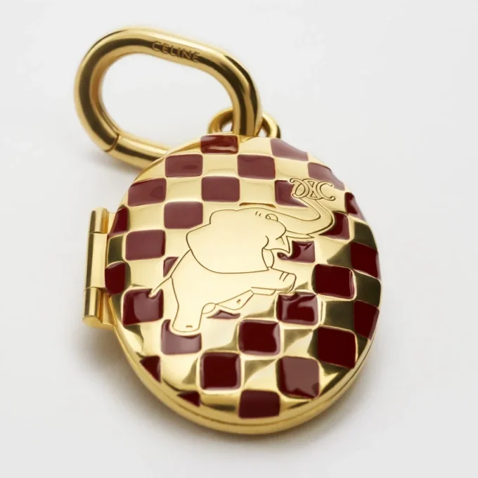 Bedels Olifantmedaillon van messing met gouden afwerking, email en staal