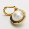 Bedels Parel van hars en messing met gouden afwerking
