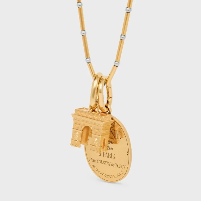 Lange ketting met bedels van messing met goud- en rhodiumafwerking