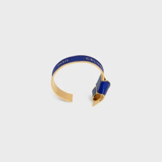 CELINE-armband met geknoopte strik van email en messing met gouden afwerking