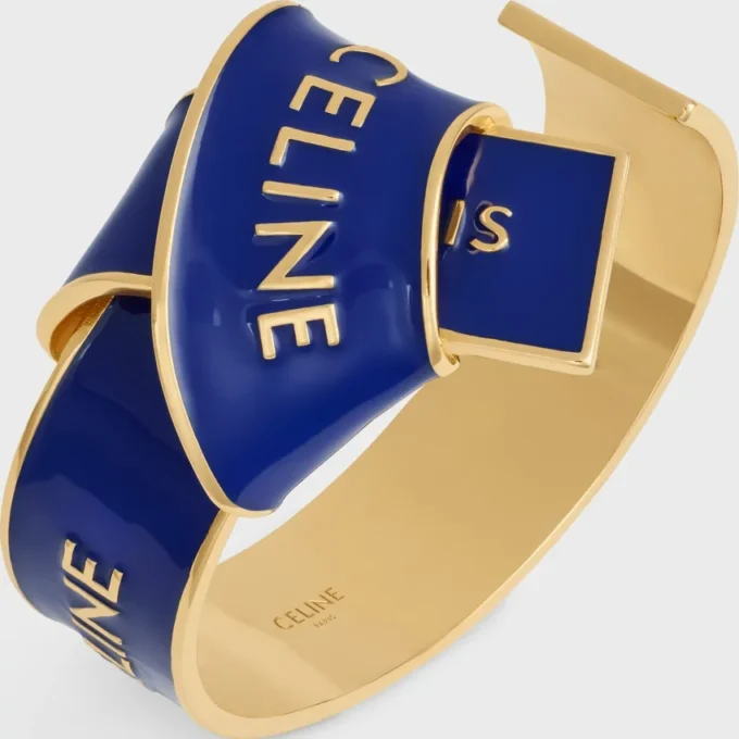 CELINE-armband met geknoopte strik van email en messing met gouden afwerking