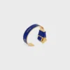 CELINE-armband met geknoopte strik van email en messing met gouden afwerking