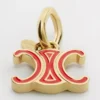 CELINE Charms Triomphe in email en messing met gouden afwerking