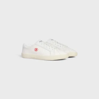 CELINE Lou lage vetersneaker met Triomphe-logo in canvas en kalfsleer
