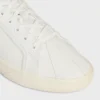 CELINE Lou lage vetersneaker met Triomphe-logo in canvas en kalfsleer