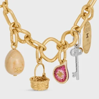 Bedels in messing met gouden afwerking, email en strass