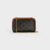 Clutch met ketting in Triomphe Canvas en lamsleer Clutch met ketting in Triomphe Canvas en lamsleer