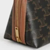 Clutch met ketting in Triomphe Canvas en lamsleer Clutch met ketting in Triomphe Canvas en lamsleer