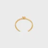 Dubbele manchet met knoop in messing met gouden afwerking