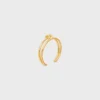 Dubbele manchet met knoop in messing met gouden afwerking