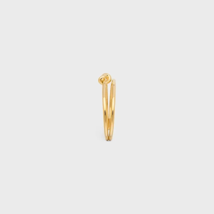 Dubbele manchet met knoop in messing met gouden afwerking