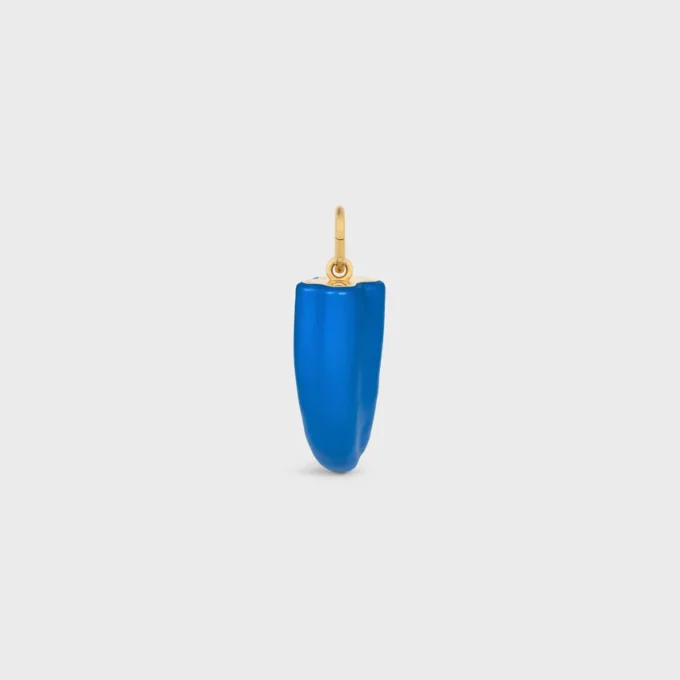 Kleine hoornbedel van hars, leer en messing met gouden afwerking