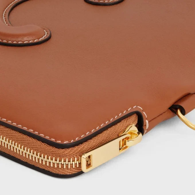 Kleine tas met riem Cuir Triomphe van glad kalfsleer