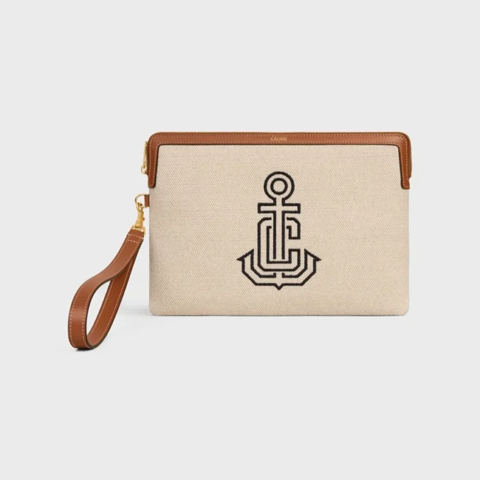 Kleine tas met riem van textiel met geborduurd anker en kalfsleer