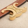Kleine Triomphe-portemonnee met klep van textiel en kalfsleer