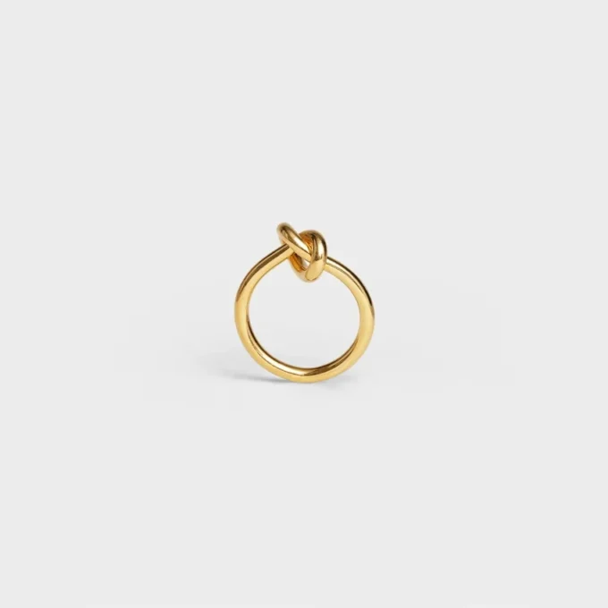 Knoopring van messing met gouden afwerking