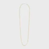 Lange ketting met bedels van messing met goud- en rhodiumafwerking