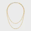 Lange ketting met bedels van messing met goud- en rhodiumafwerking