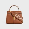 Lange riem van wol met CELINE-jacquard en gouden afwerking