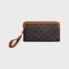 Lange tas met riem van Triomphe Canvas en kalfsleer