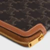 Lange tas met riem van Triomphe Canvas en kalfsleer