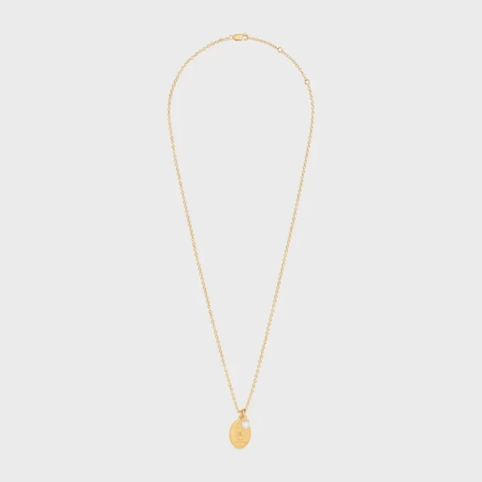 Les Perles CELINE medaillonketting van harsparel en messing met gouden afwerking