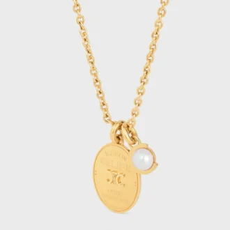 Les Perles CELINE medaillonketting van harsparel en messing met gouden afwerking