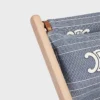 Ligstoel van hout en jacquardtextiel
