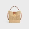 Medium Louise-bucket in raffia en kalfsleer