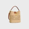 Medium Louise-bucket in raffia en kalfsleer