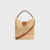 Medium Louise-bucket in raffia en kalfsleer