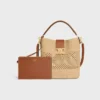 Medium Louise-bucket in raffia en kalfsleer