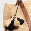 Multi Pompon-bedeltje van raffia en glad lamsleer