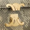 Teen Triomphe-tas in parelmoer python