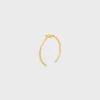 Triomphe asymmetrische manchet in messing met gouden afwerking