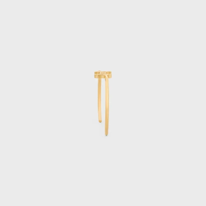 Triomphe asymmetrische manchet in messing met gouden afwerking