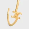 Triomphe asymmetrische manchet in messing met gouden afwerking