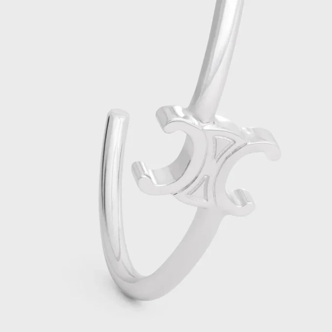 Triomphe asymmetrische manchet in messing met rhodiumafwerking