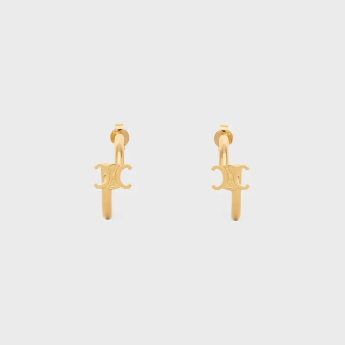Triomphe asymmetrische oorringen van messing met gouden afwerking