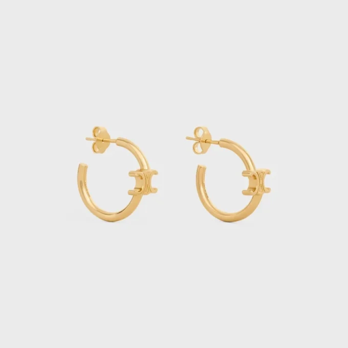 Triomphe asymmetrische oorringen van messing met gouden afwerking