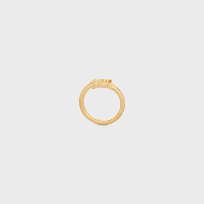 Triomphe asymmetrische ring van messing met gouden afwerking