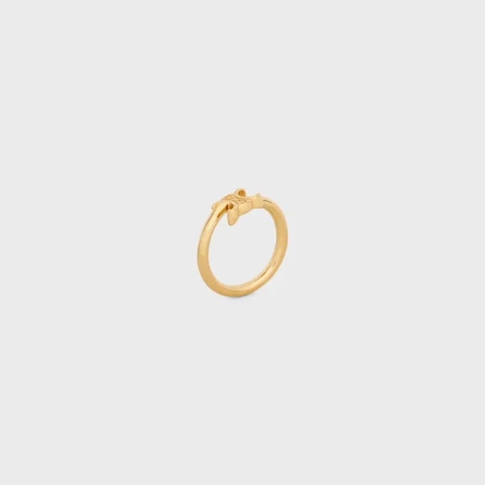 Triomphe asymmetrische ring van messing met gouden afwerking