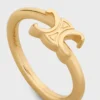 Triomphe asymmetrische ring van messing met gouden afwerking