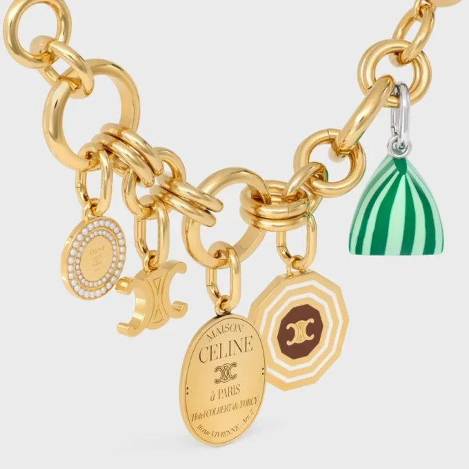 Triomphe-bedels in messing met gouden afwerking