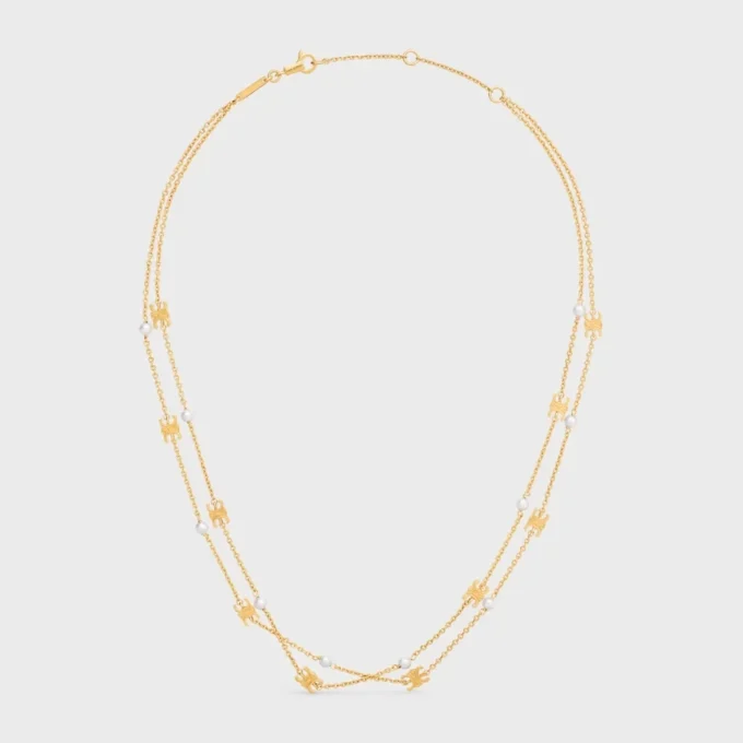 Triomphe Pearl dubbele ketting van messing met gouden afwerking en harsparels