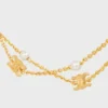 Triomphe Pearl dubbele ketting van messing met gouden afwerking en harsparels