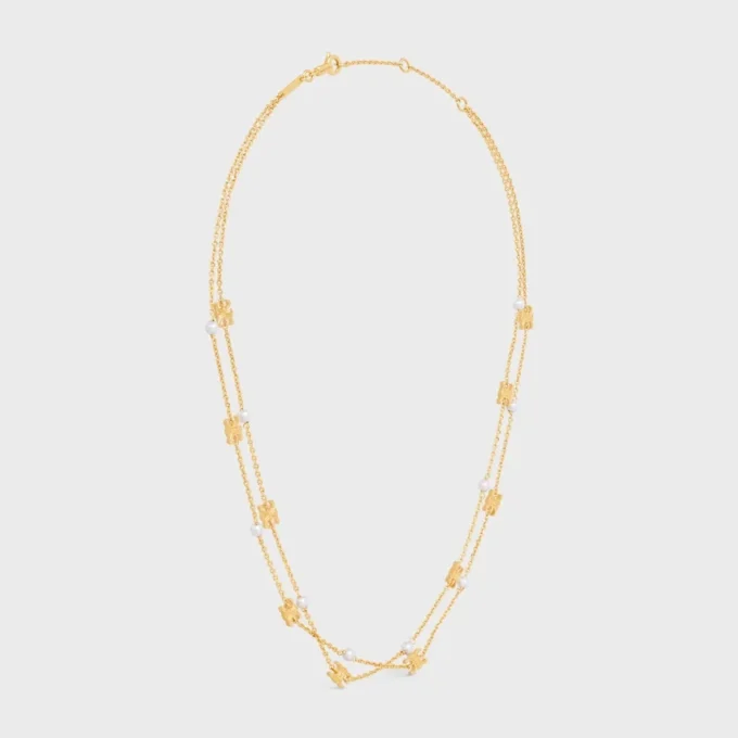 Triomphe Pearl dubbele ketting van messing met gouden afwerking en harsparels