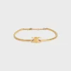 Triomphe scharnierende armband van messing met gouden afwerking