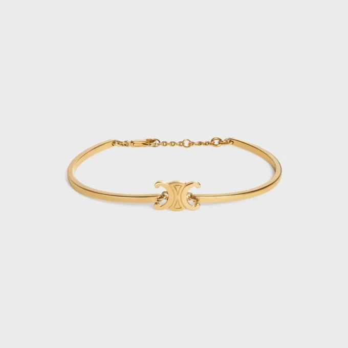 Triomphe scharnierende armband van messing met gouden afwerking